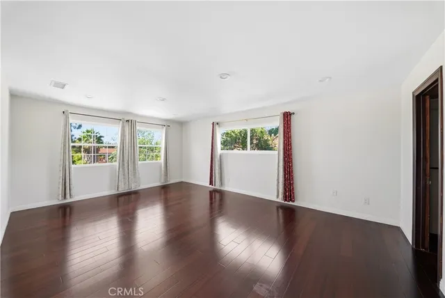 a large kitchen with kitchen island granite countertop a large counter top space and stainless steel appliances