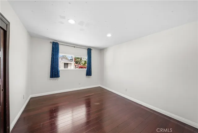 a large kitchen with granite countertop a stove a sink and a granite counter tops