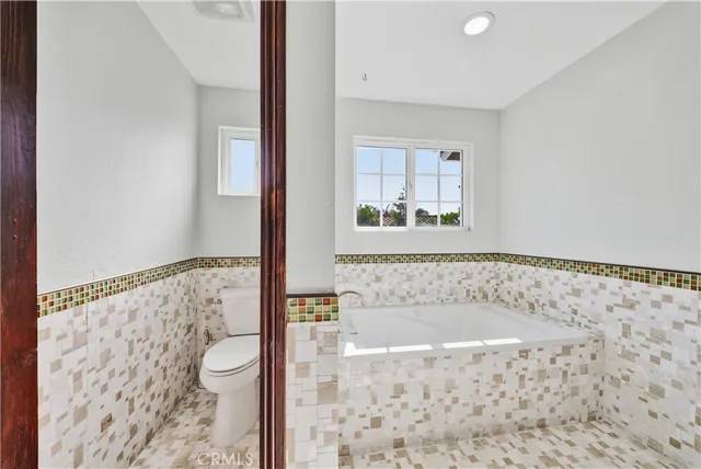 an aerial view of a house with swimming pool and outdoor space