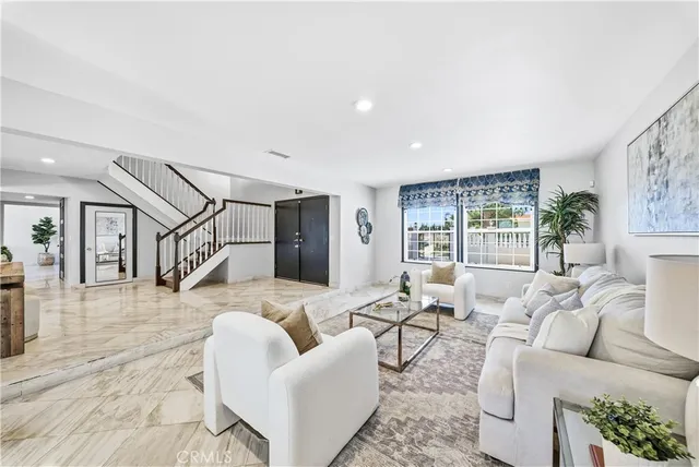 a living room with furniture and a large window