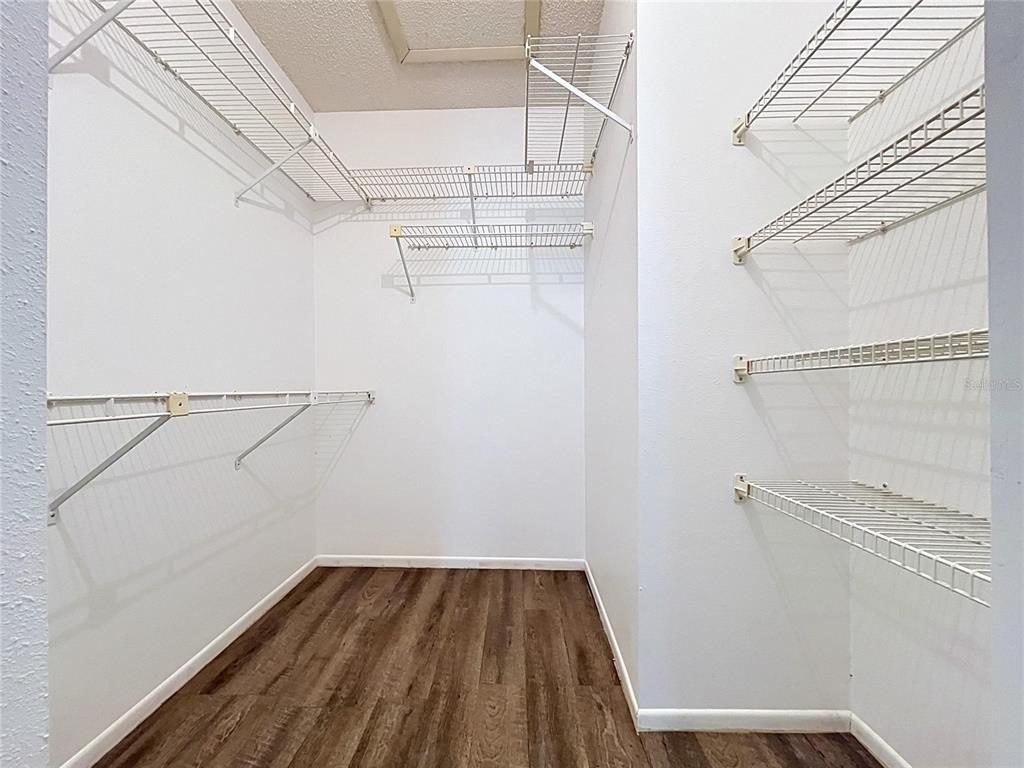 9319 Trowbridge Court New Port Richey, FL 34655 - Photo 45 of 78 a view of a room with racks on the wall