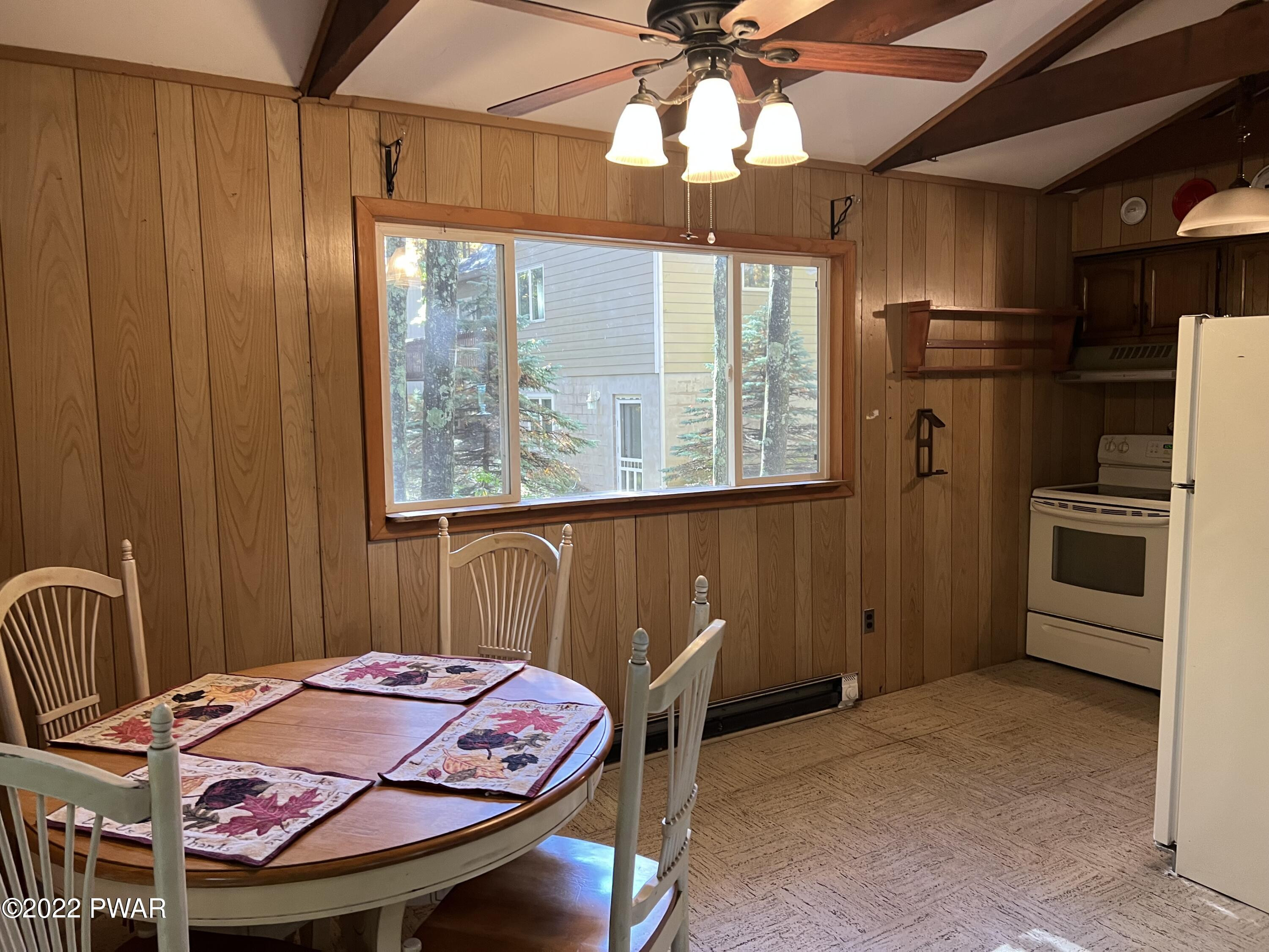 135 Rodeo Drive Hawley, PA 18428 - Photo 11 of 23 a bed room with a bed and a chandelier
