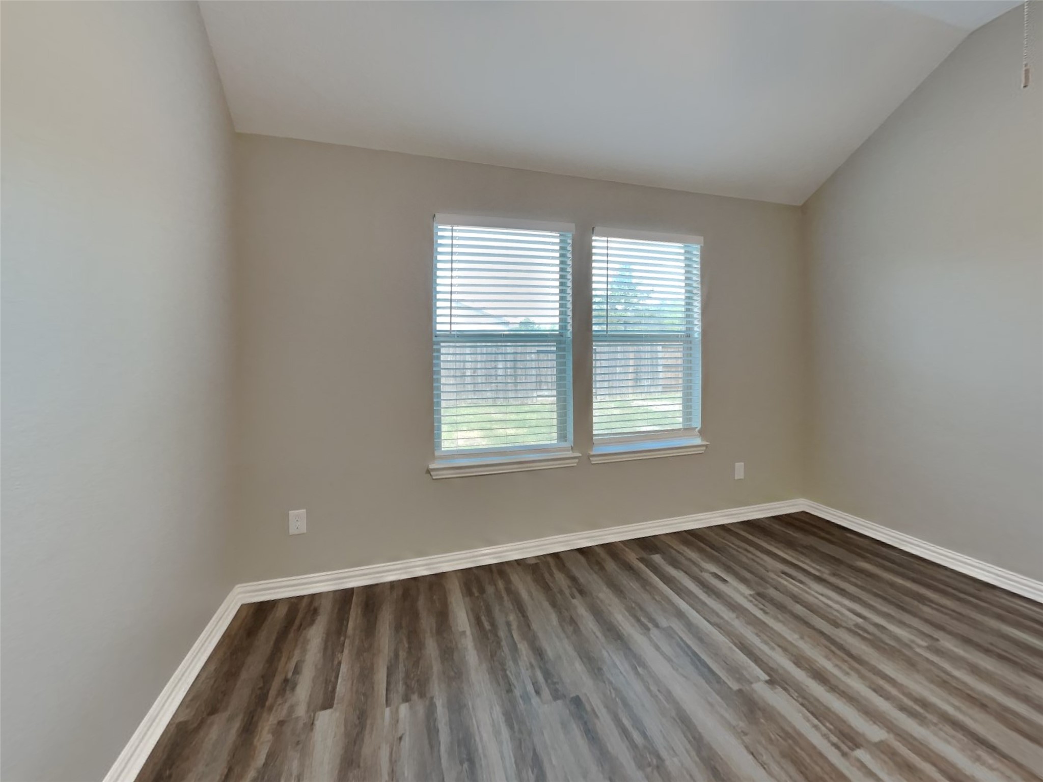3007 Lockeridge Village Drive Spring, TX 77386 - Photo 2 of 18 a view of an empty room with wooden floor and a window