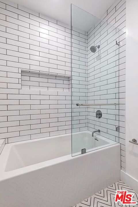 1436 Edgecliffe Drive, Unit 102 Los Angeles, CA 90026 - Photo 14 of 18 a bathroom with a bathtub and shower