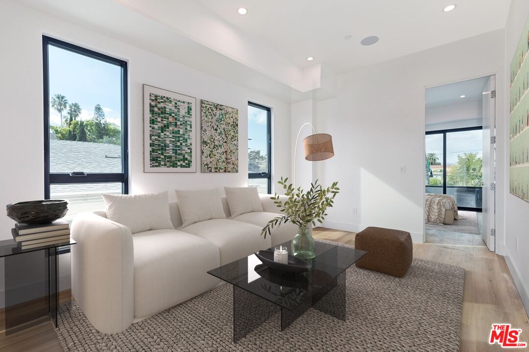 1436 Edgecliffe Drive, Unit 102 Los Angeles, CA 90026 - Photo 9 of 18 a living room with furniture and a window