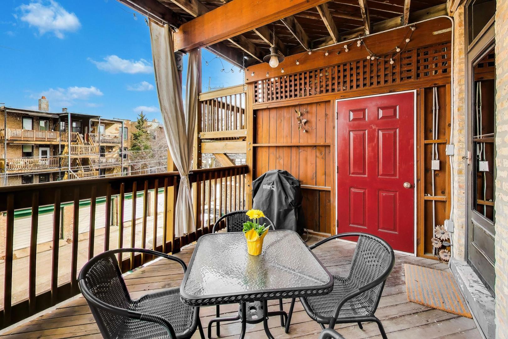 4441 North Beacon Street, Unit 2A Chicago, IL 60640 - Photo 22 of 23 a view of a chairs and table in the balcony