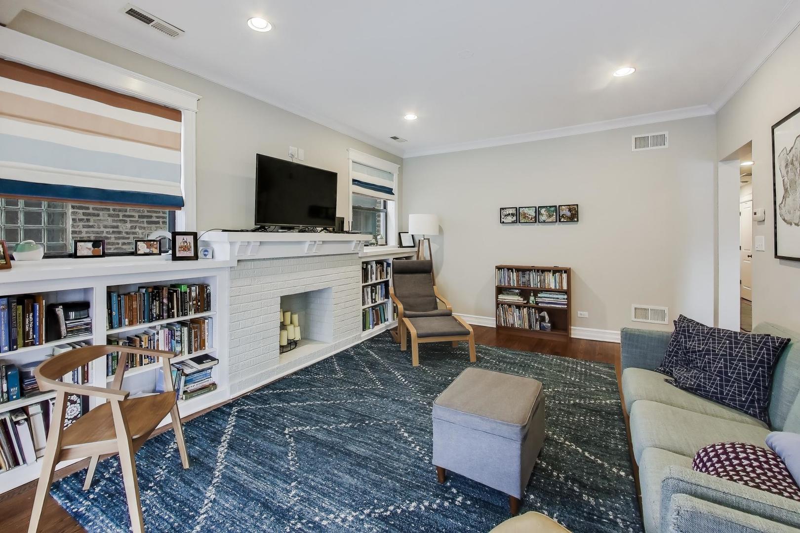 4441 North Beacon Street, Unit 2A Chicago, IL 60640 - Photo 5 of 23 a living room with furniture and a flat screen tv