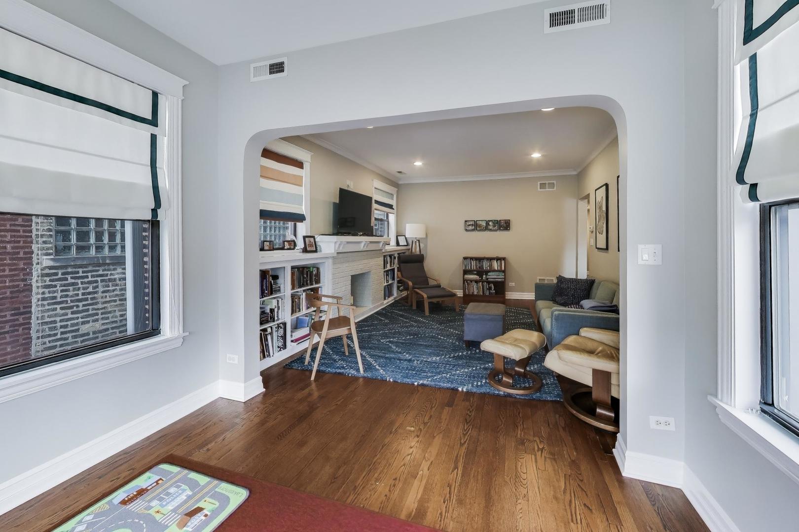 4441 North Beacon Street, Unit 2A Chicago, IL 60640 - Photo 7 of 23 a living room with furniture and a wooden floor