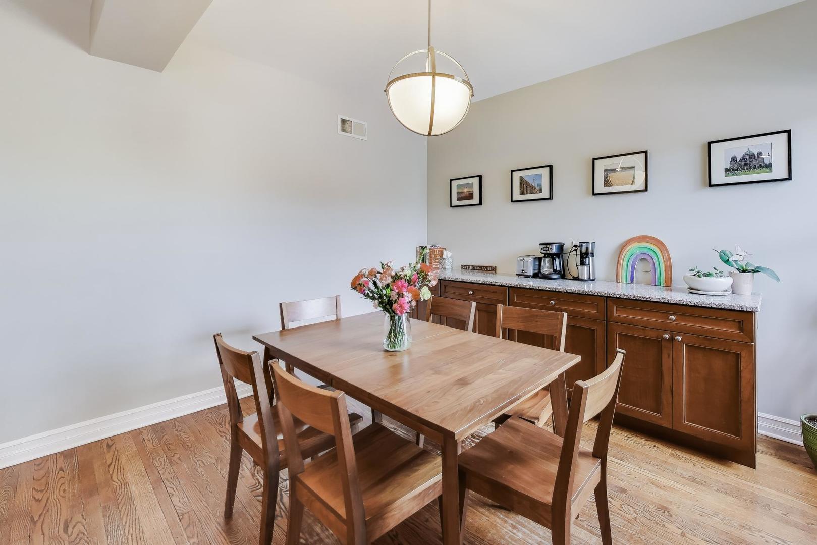 4441 North Beacon Street, Unit 2A Chicago, IL 60640 - Photo 8 of 23 a view of a dining room that has a table and chairs in it