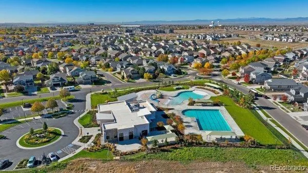 an aerial view of a house with a swimming pool yard and outdoor seating