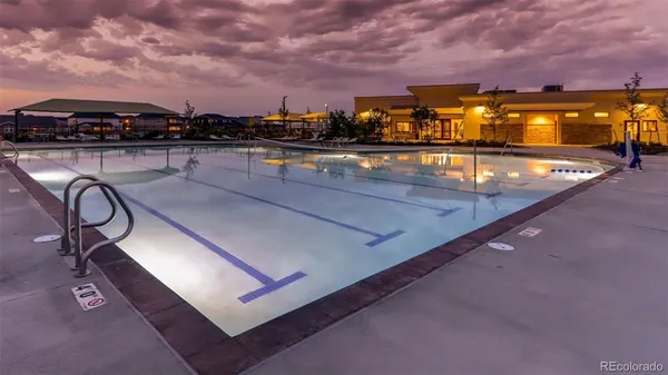 a view of swimming pool with furniture