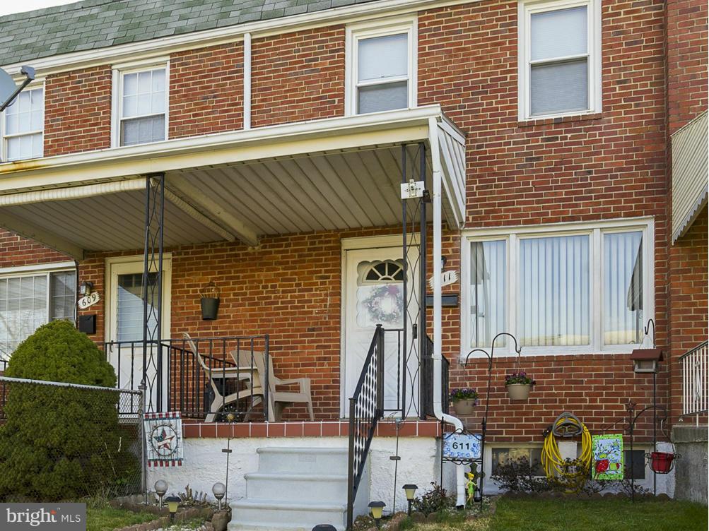 611 Aldworth Road Baltimore, MD 21222 - Photo 3 of 25 a front view of a house with a yard