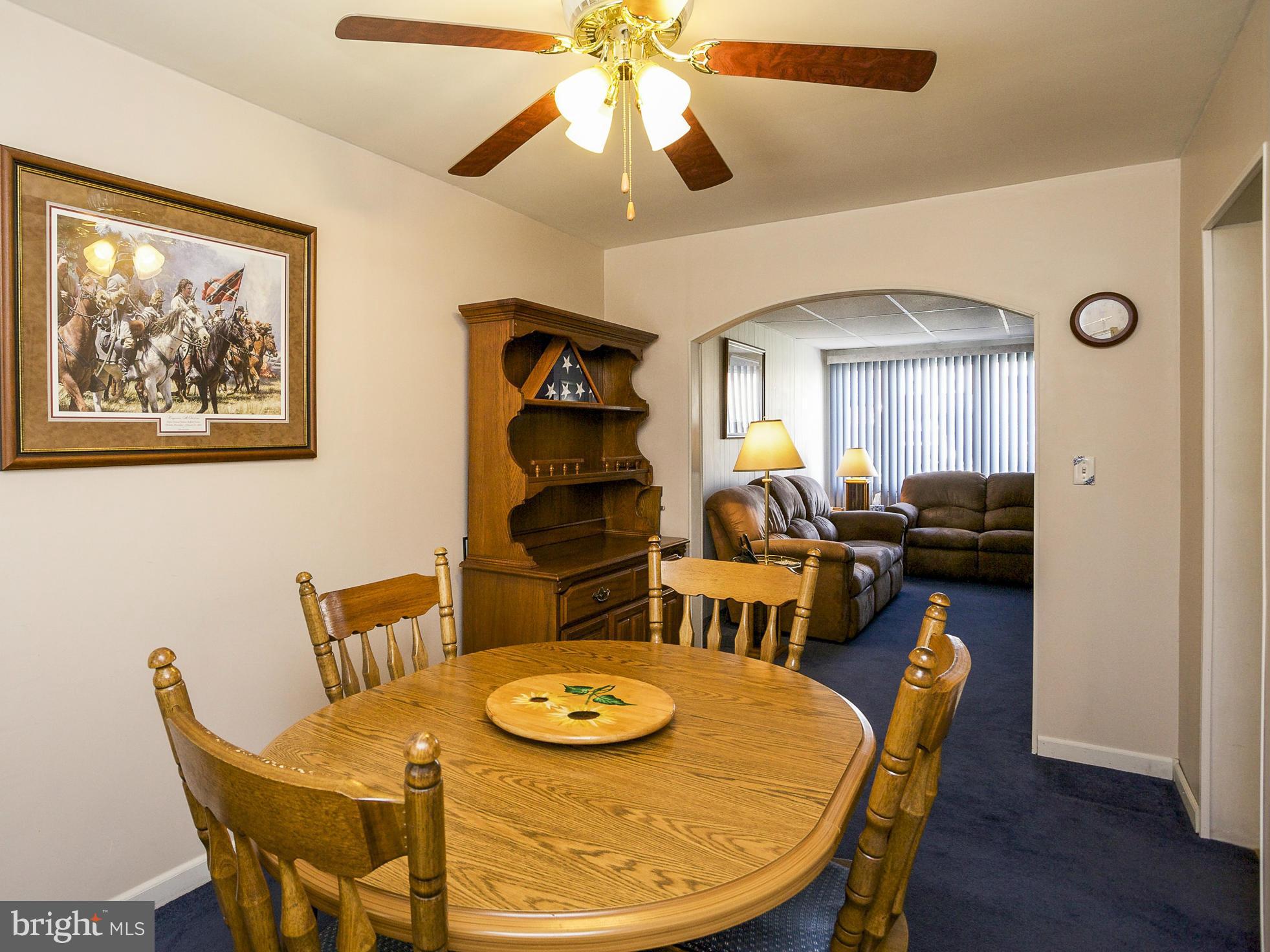 611 Aldworth Road Baltimore, MD 21222 - Photo 8 of 25 a view of a dining room with furniture and wooden floor
