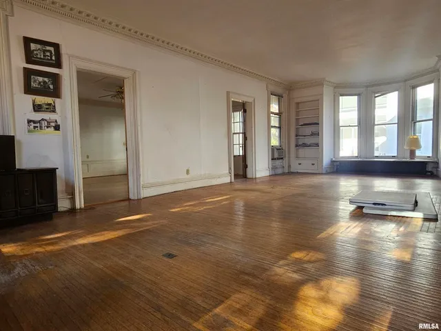 a kitchen with a refrigerator and a stove