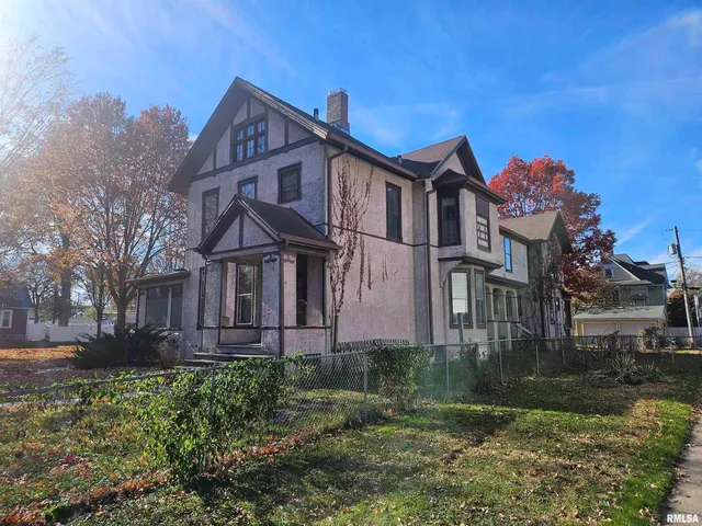 a kitchen with a refrigerator and a sink