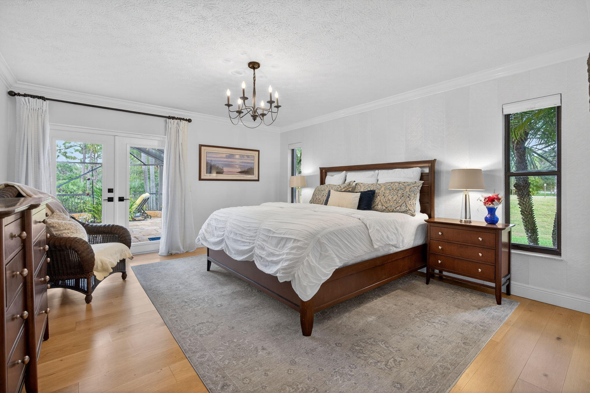 1488 Southeast Colony Way Jupiter, FL 33478 - Photo 24 of 46 Primary Bedroom wi/ French Doors to Pool