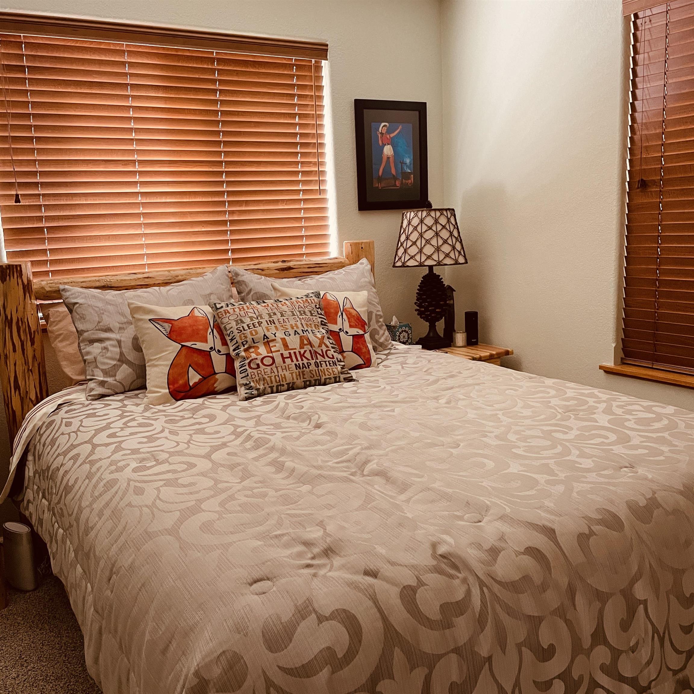 1154 Rocky Cliff Road Portola, CA 96122 - Photo 15 of 15 a bedroom with a bed and a window