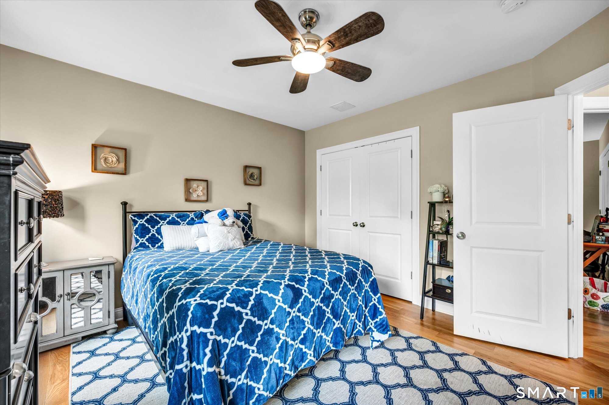 16 Sweetheart Mountain Road Canton, CT 06019 - Photo 22 of 40 a bedroom with a bed and painting on the wall