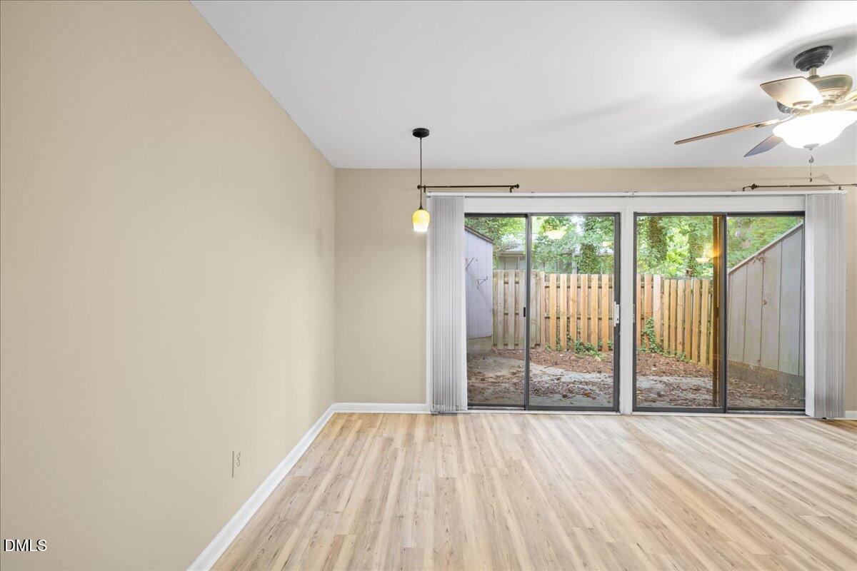 1738 Quail Ridge Road Raleigh, NC 27609 - Photo 12 of 38 wooden floor in an empty room with a window