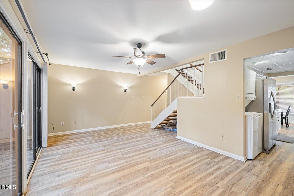1738 Quail Ridge Road Raleigh, NC 27609 - Photo 15 of 38 a view of an entryway with wooden floor and a fire place