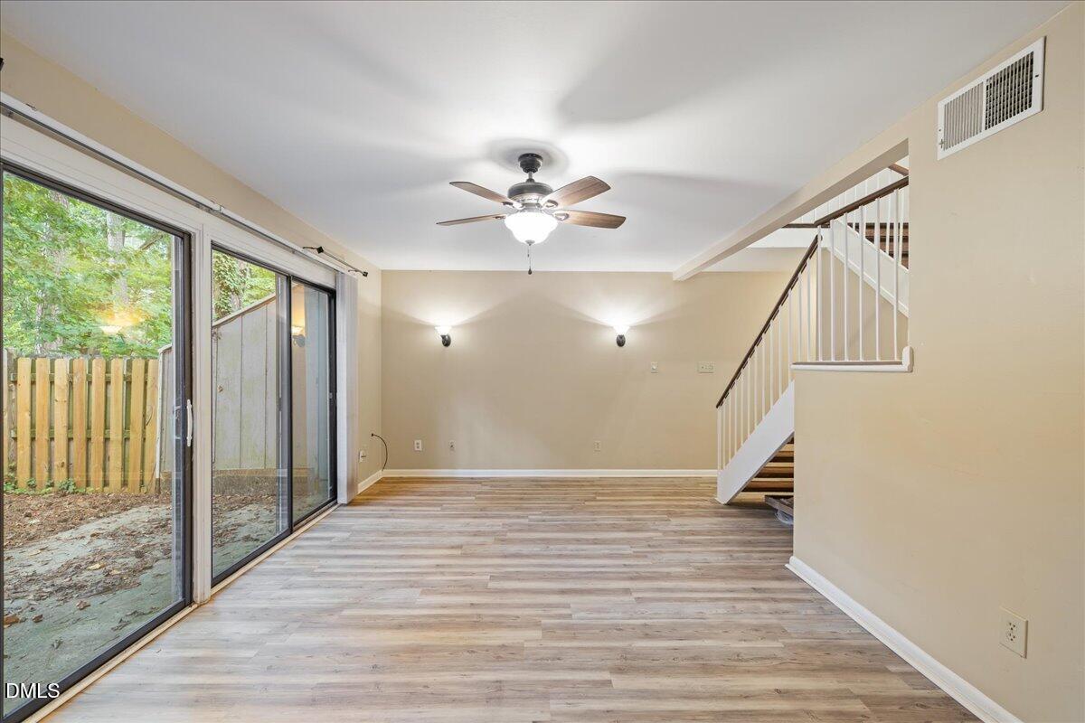 1738 Quail Ridge Road Raleigh, NC 27609 - Photo 17 of 38 a view of an entryway with wooden floor and door