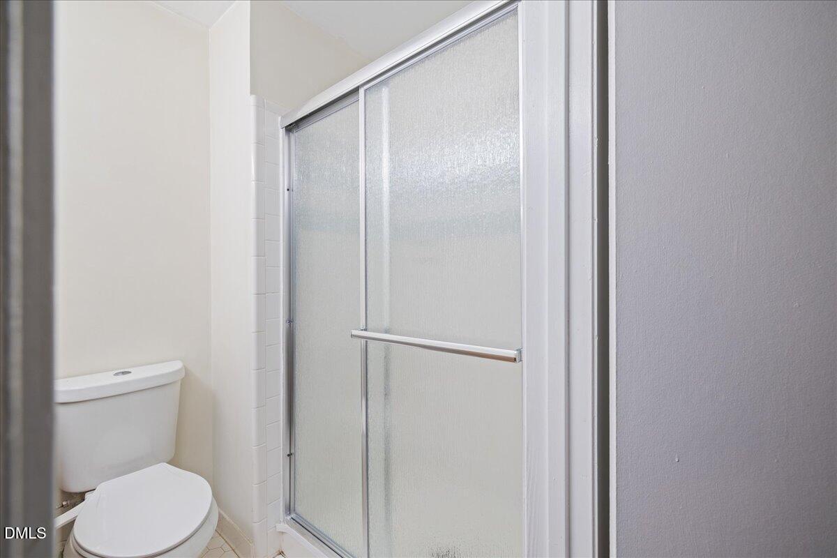1738 Quail Ridge Road Raleigh, NC 27609 - Photo 27 of 38 a white toilet sitting next to a bathroom sink