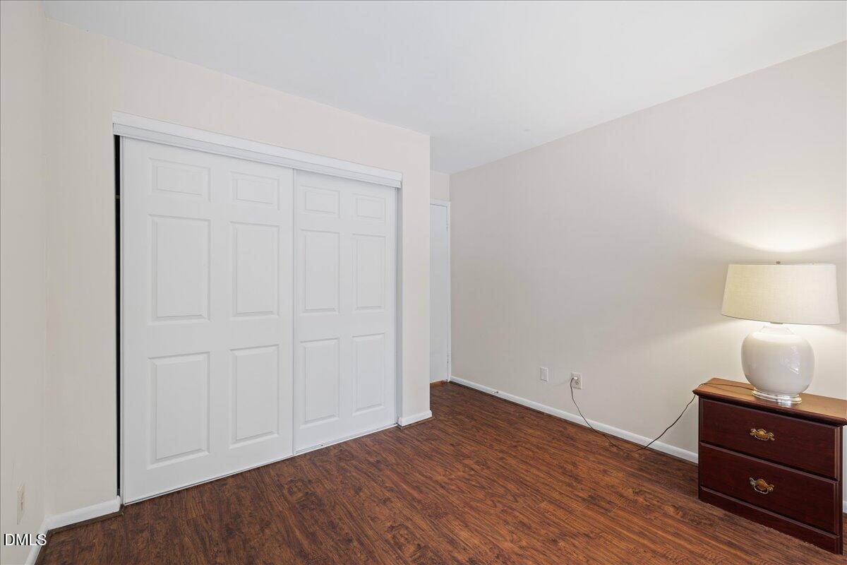 1738 Quail Ridge Road Raleigh, NC 27609 - Photo 34 of 38 a room that has a bed and a night stand