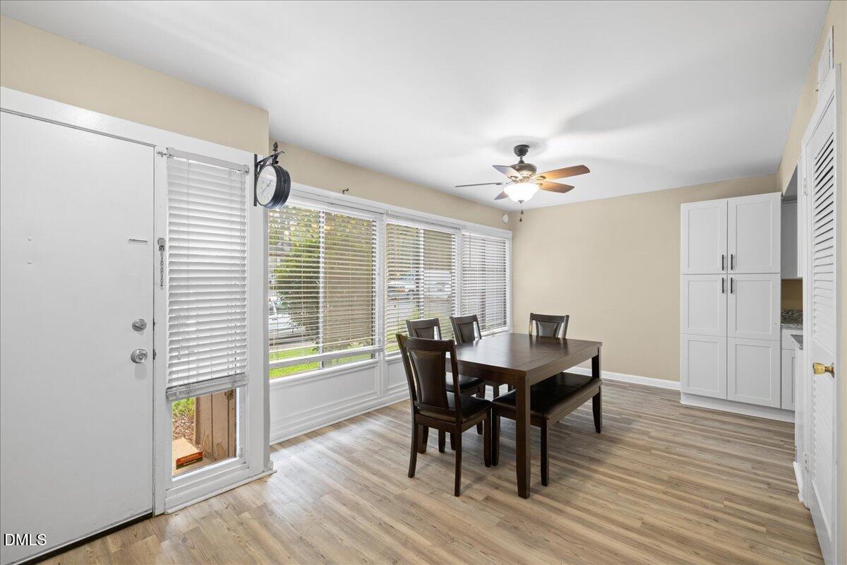 1738 Quail Ridge Road Raleigh, NC 27609 - Photo 5 of 38 a view of a dining room with furniture and wooden floor