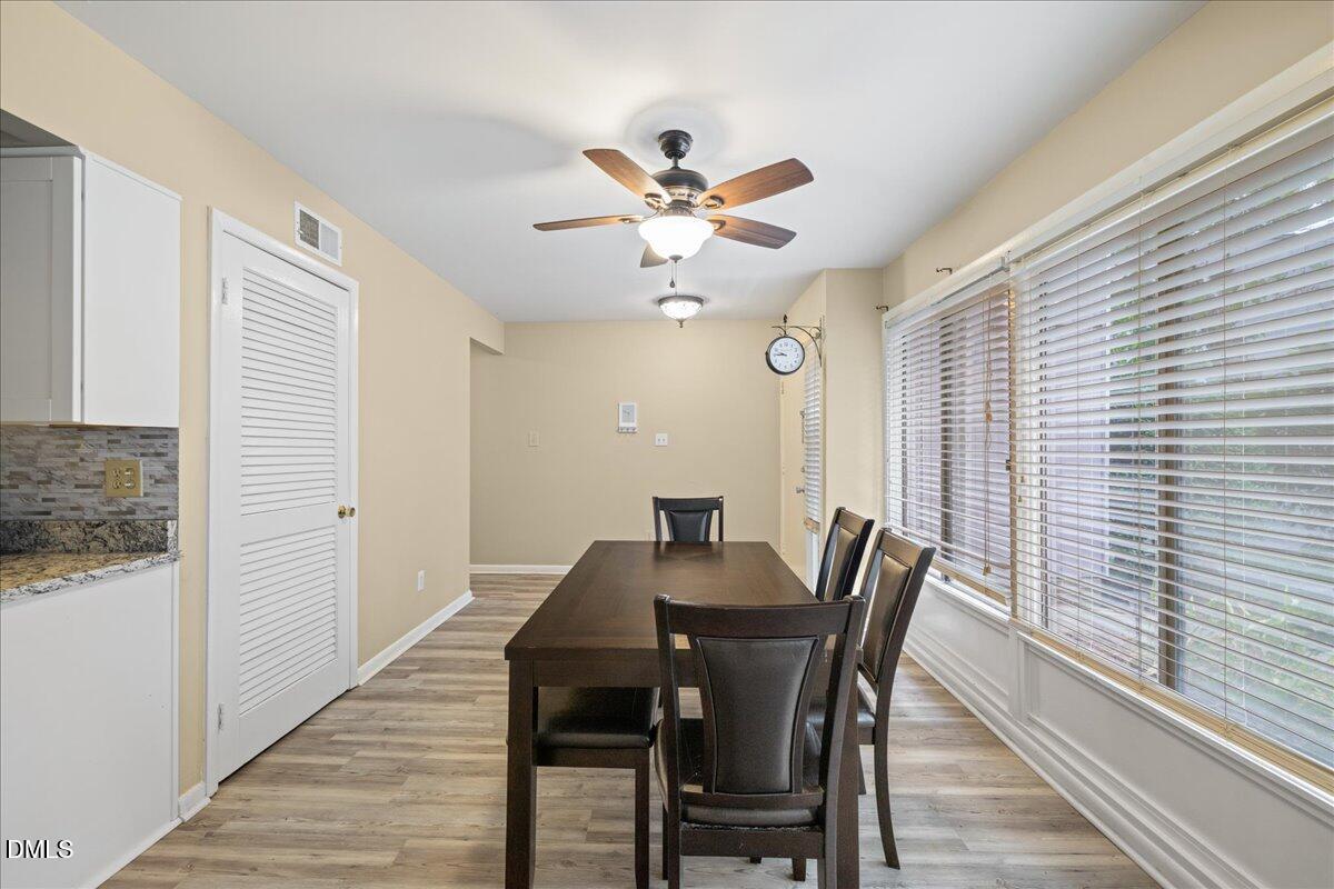 1738 Quail Ridge Road Raleigh, NC 27609 - Photo 6 of 38 a view of a dining room with furniture and a window