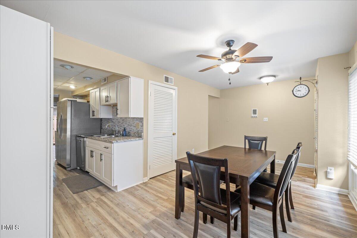 1738 Quail Ridge Road Raleigh, NC 27609 - Photo 7 of 38 a view of a dining room with furniture and wooden floor