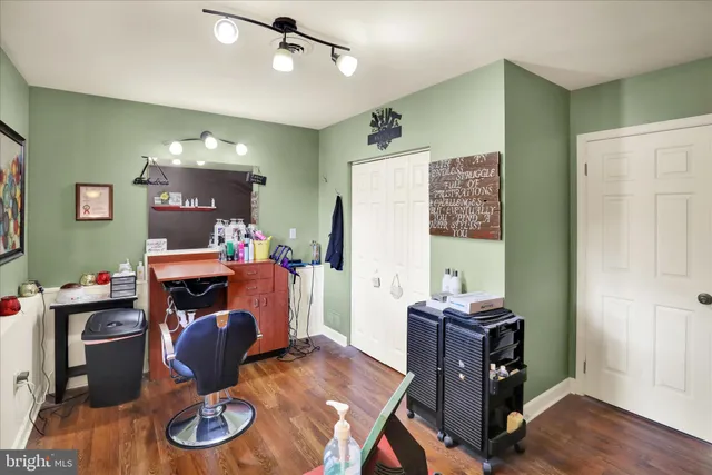 a workspace with furniture and wooden floor