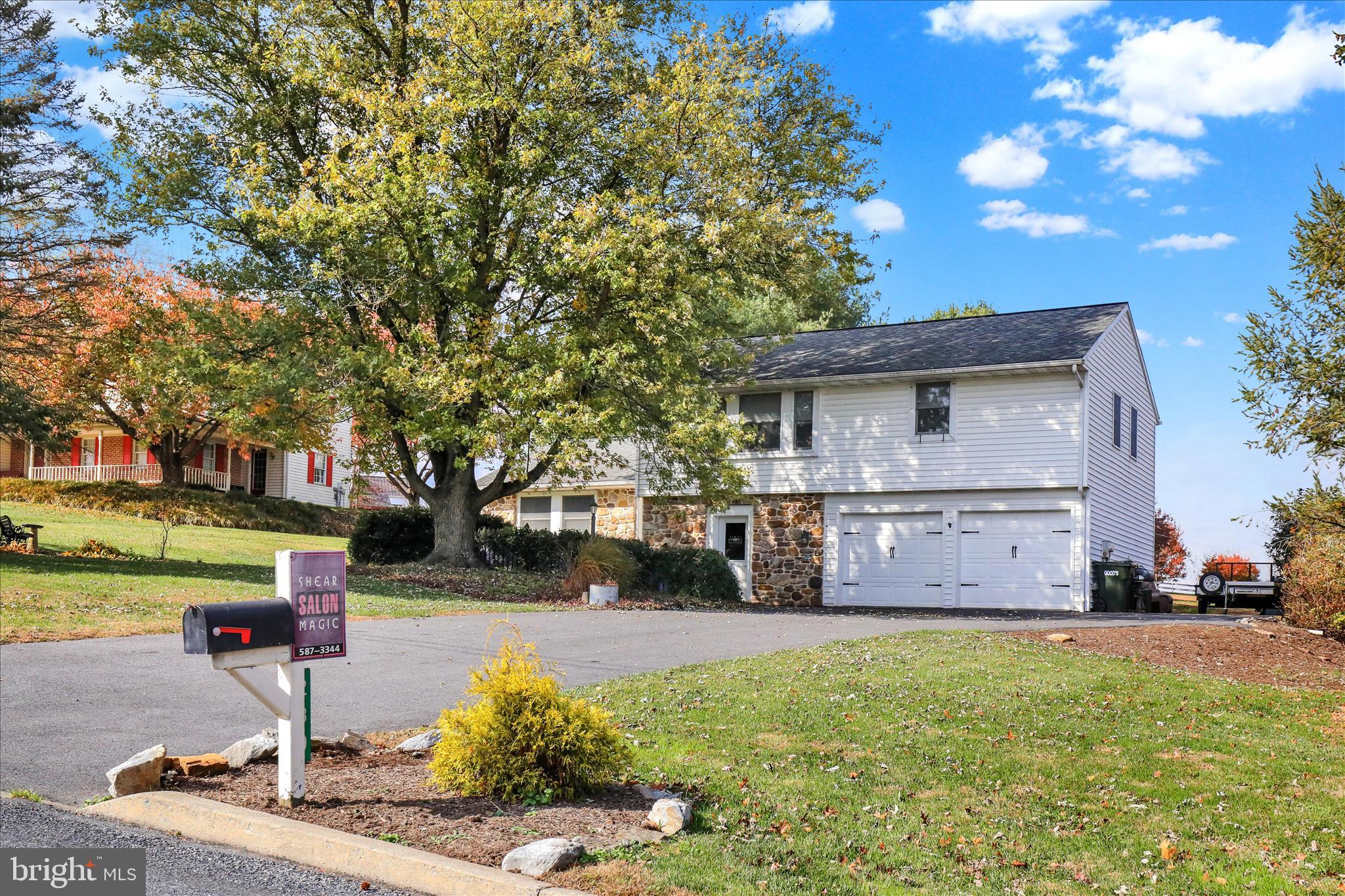 280 Snavely Mill Road Lititz, PA 17543 - Photo 3 of 45 a front view of a house with a yard and a garden