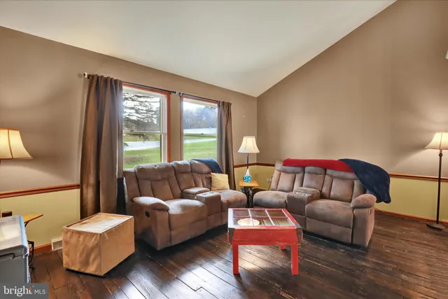 a living room with furniture and a window
