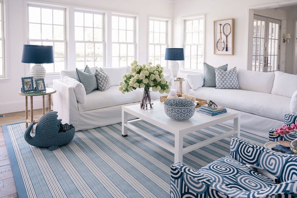 106 A Surfside Road, Unit EAST Nantucket, MA 02554 - Photo 11 of 42 a living room with furniture and a flat screen tv