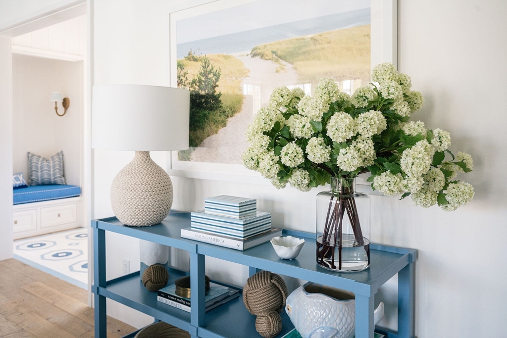 106 A Surfside Road, Unit EAST Nantucket, MA 02554 - Photo 12 of 42 a vase of flowers sitting on a table