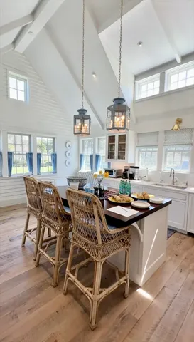 a dining room with furniture and wooden floor