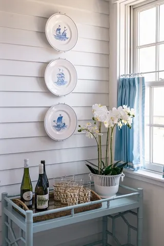 a kitchen with stainless steel appliances kitchen island granite countertop a sink and wooden cabinets