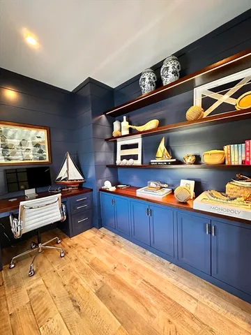 a bathroom with a window and mirror