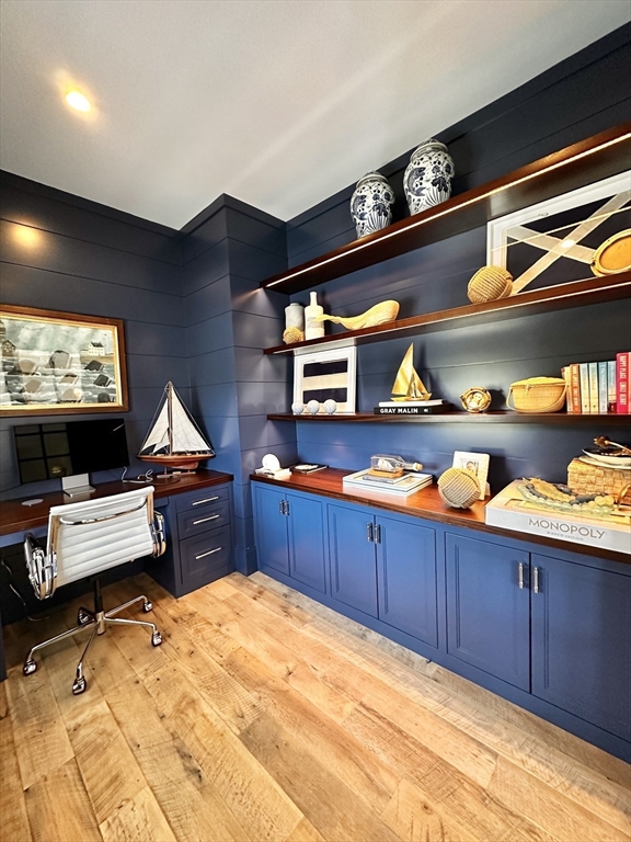 106 A Surfside Road, Unit EAST Nantucket, MA 02554 - Photo 19 of 42 a kitchen with stainless steel appliances kitchen island granite countertop a sink and wooden cabinets