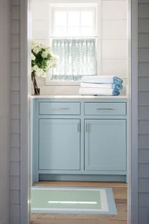 a view of a kitchen sink cabinets and wooden floor