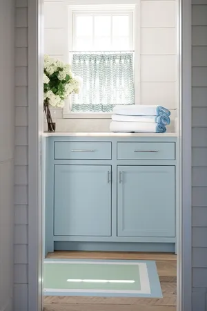 a view of a kitchen sink cabinets and wooden floor