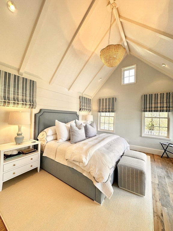 106 A Surfside Road, Unit EAST Nantucket, MA 02554 - Photo 22 of 42 a bedroom with a bed and a window