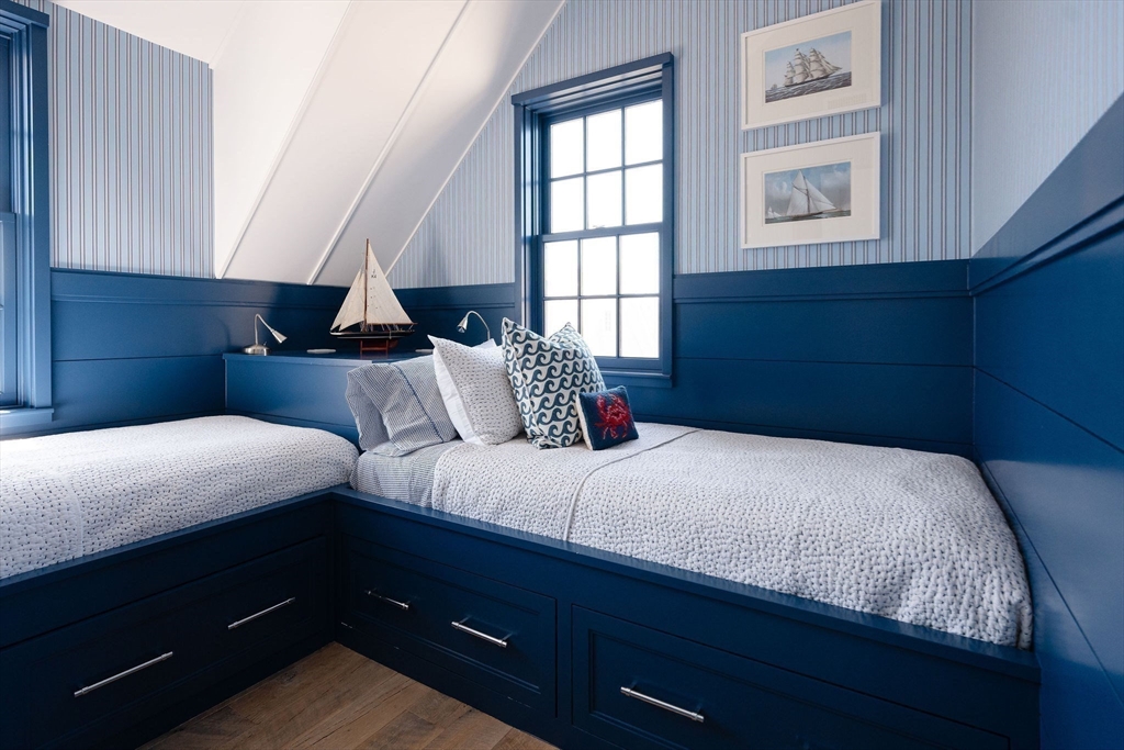 106 A Surfside Road, Unit EAST Nantucket, MA 02554 - Photo 24 of 42 a bedroom with bed and window