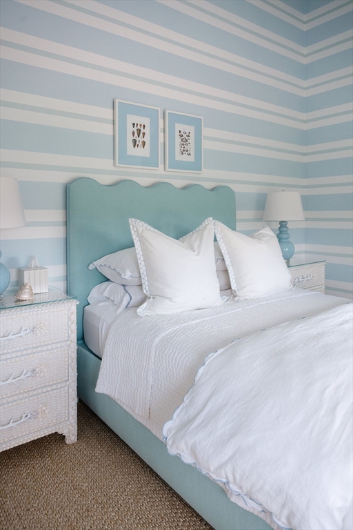 106 A Surfside Road, Unit EAST Nantucket, MA 02554 - Photo 26 of 42 a bedroom with a bed and a dresser