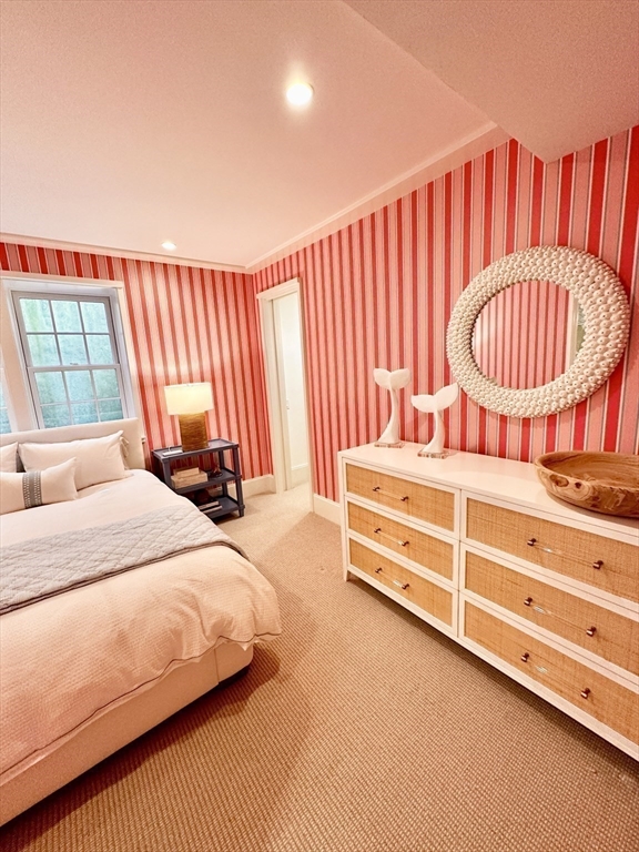 106 A Surfside Road, Unit EAST Nantucket, MA 02554 - Photo 30 of 42 a bedroom with a bed and a dresser