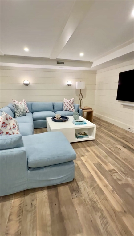 106 A Surfside Road, Unit EAST Nantucket, MA 02554 - Photo 32 of 42 a living room with furniture and a flat screen tv