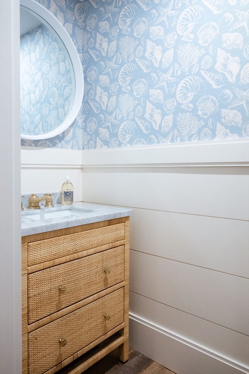 106 A Surfside Road, Unit EAST Nantucket, MA 02554 - Photo 33 of 42 a bathroom with a sink and vanity