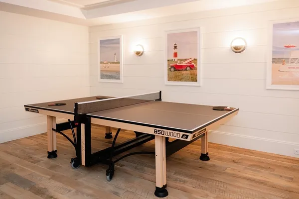 a view of a workspace with furniture and floor to ceiling window