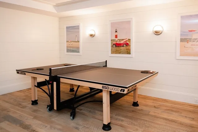 a view of a workspace with furniture and floor to ceiling window