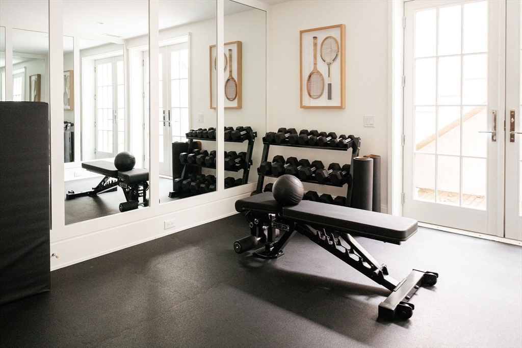 106 A Surfside Road, Unit EAST Nantucket, MA 02554 - Photo 35 of 42 a view of a workspace with furniture and floor to ceiling window
